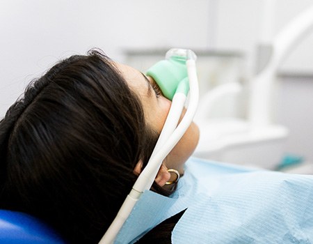 Woman relaxing while breathing in nitrous oxide