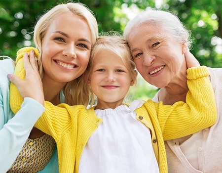 Mother daughter and granddaughter smiling