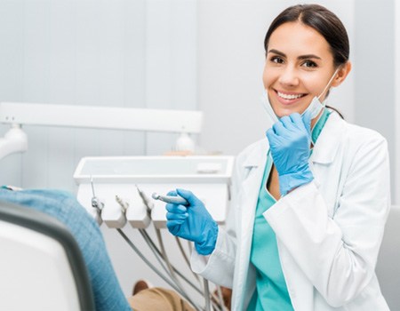 Dentist smiling during patient's dental checkup