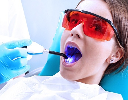 Child recieving dental sealants