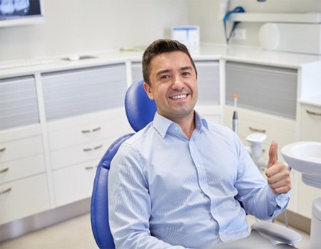 Man giving thumbs up while visiting an emergency dentist in Spring House, PA