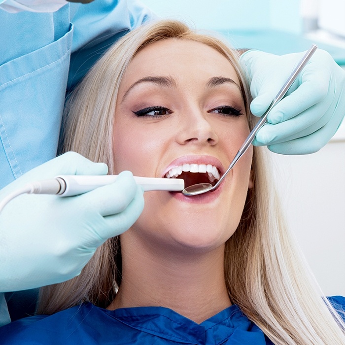 Woman receiving dental exam