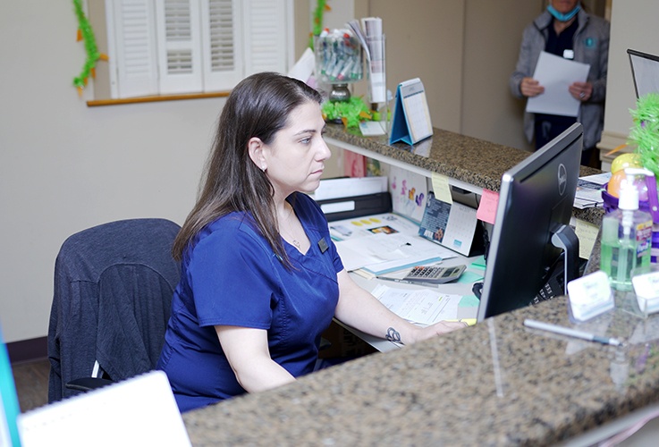 Team member working behind desk