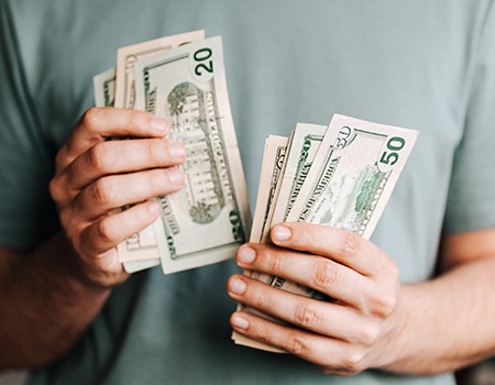 Man’s hands counting cash