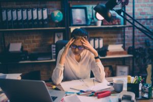 Stressed woman in quarantine trying to avoid bad dental habits