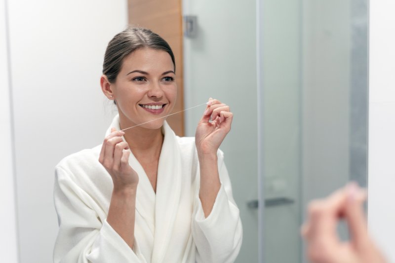 Woman holding floss