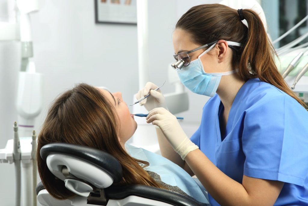 Woman at dentist for regular check up