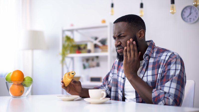 man bothered by tooth sensitivity in Spring House