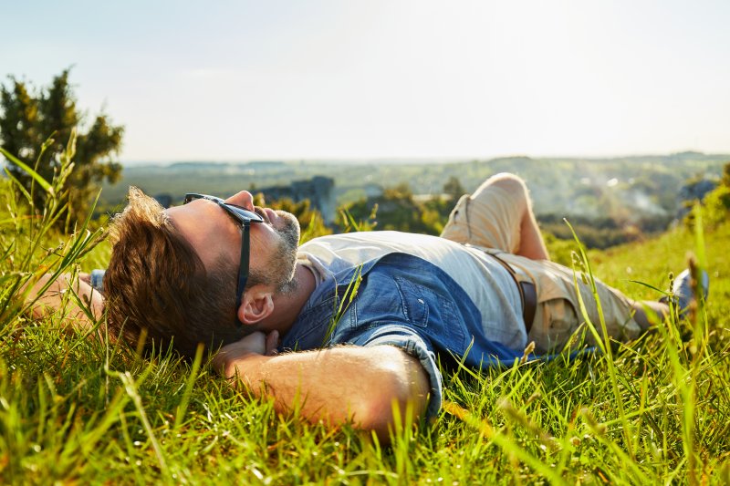 man relaxing after getting dental implants in Spring House