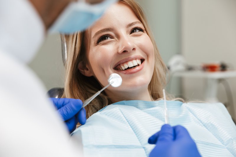 Lady smiles at dentist