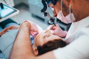 Dentist working on patient. 
