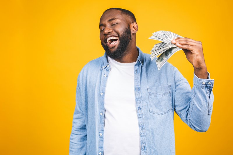 Patient fanning self with money