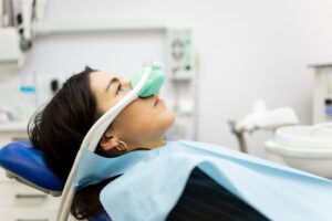 Patient receiving nitrous oxide sedation at the dentist. 